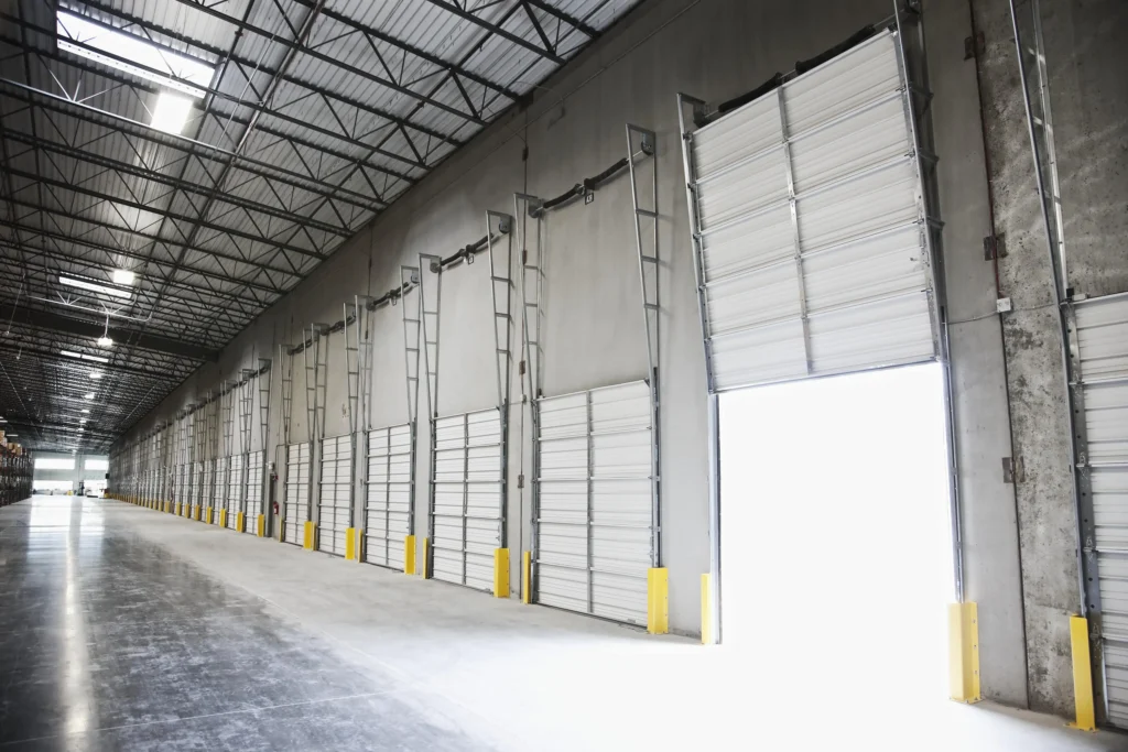 open-door-at-loading-dock-in-warehouse-2023-11-27-04-54-44-utc-min